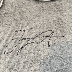 TL signed shirt from cardboard cutout